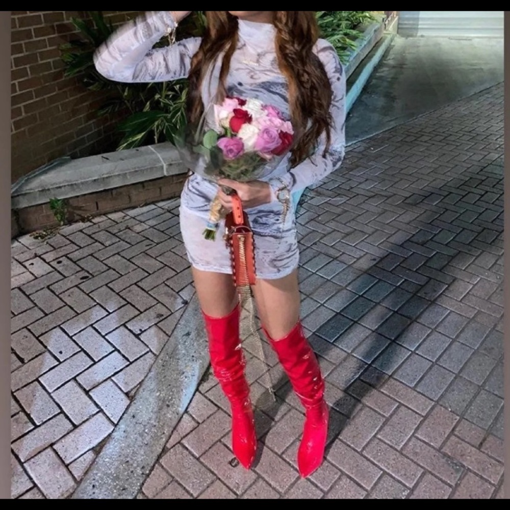 Thigh high red vinyl boots